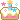 pixel art of a birthday cake with one candle and flashing stars across the top.