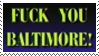 dark blue stamp with the yellow text reading FUCK YOU BALTIMORE!.