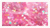 a stamp featuring a gif of someone playing with a glittery pink slime.'